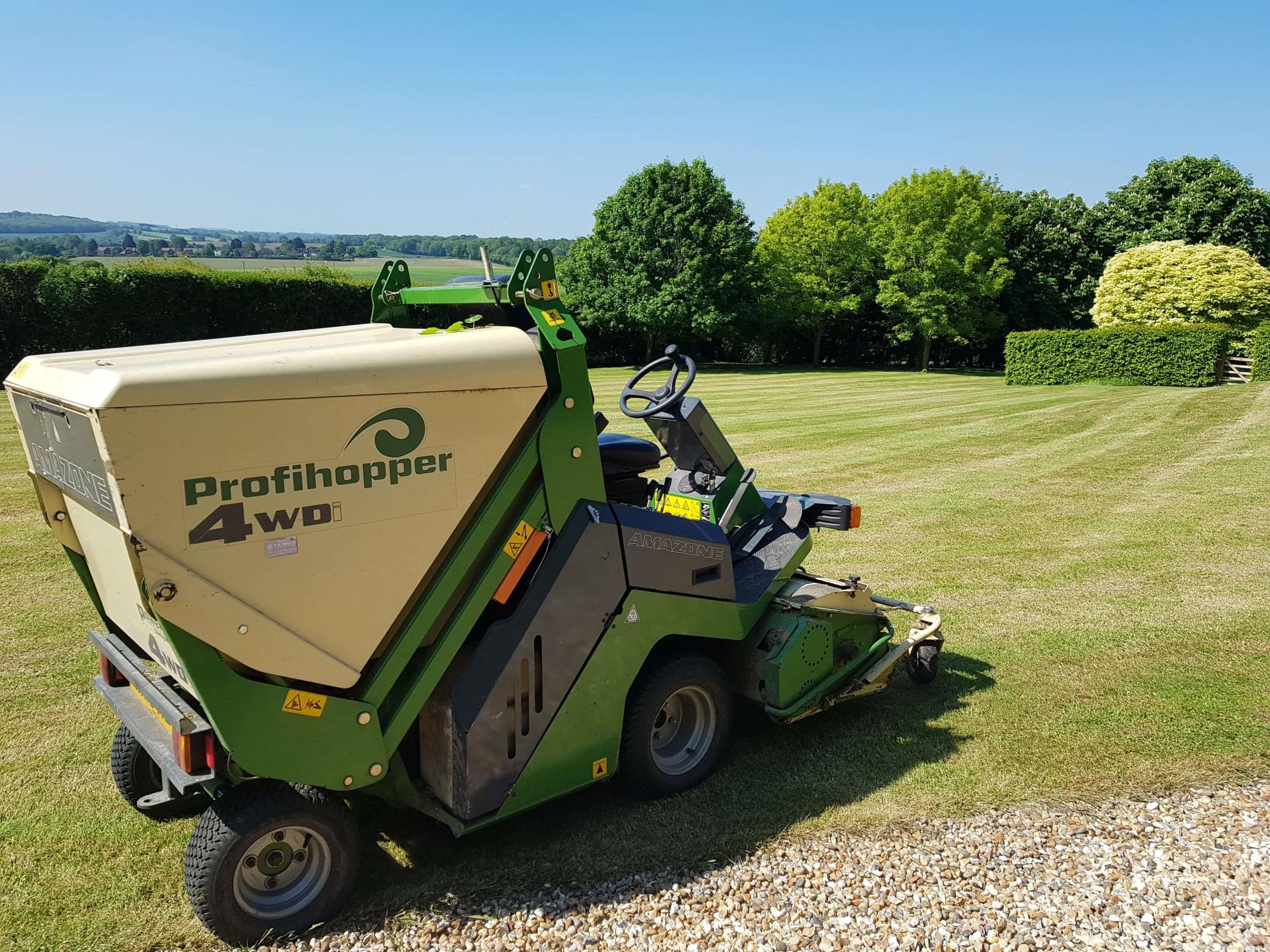 Lawn mower on large lawn after mowing completed